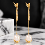 Pearl earrings with white topaz